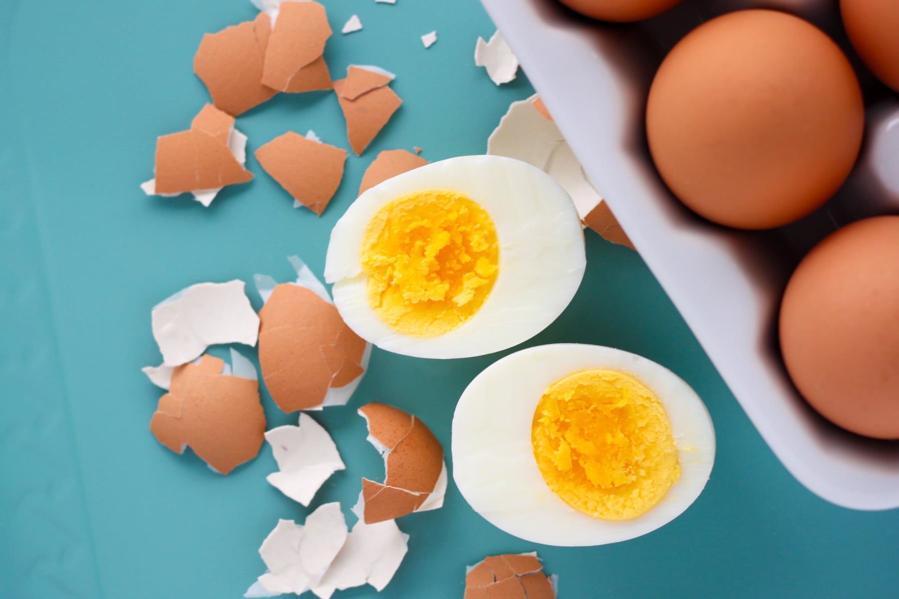 555 instant pot hard boiled eggs pressure cooked and cracked open to see the soft perfect yolk