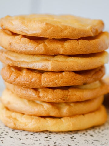 a close up image of the easy cottage cheese cloud bread stacked up