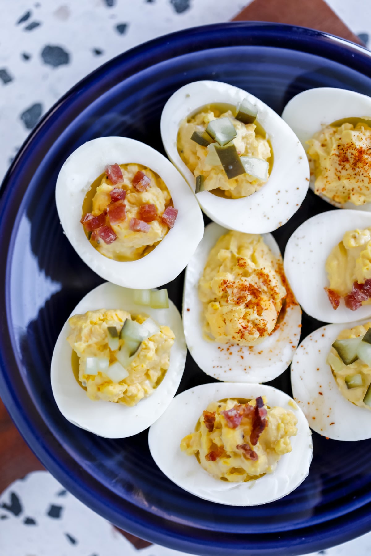 no carb deviled eggs with mayo and mustard on a blue plate