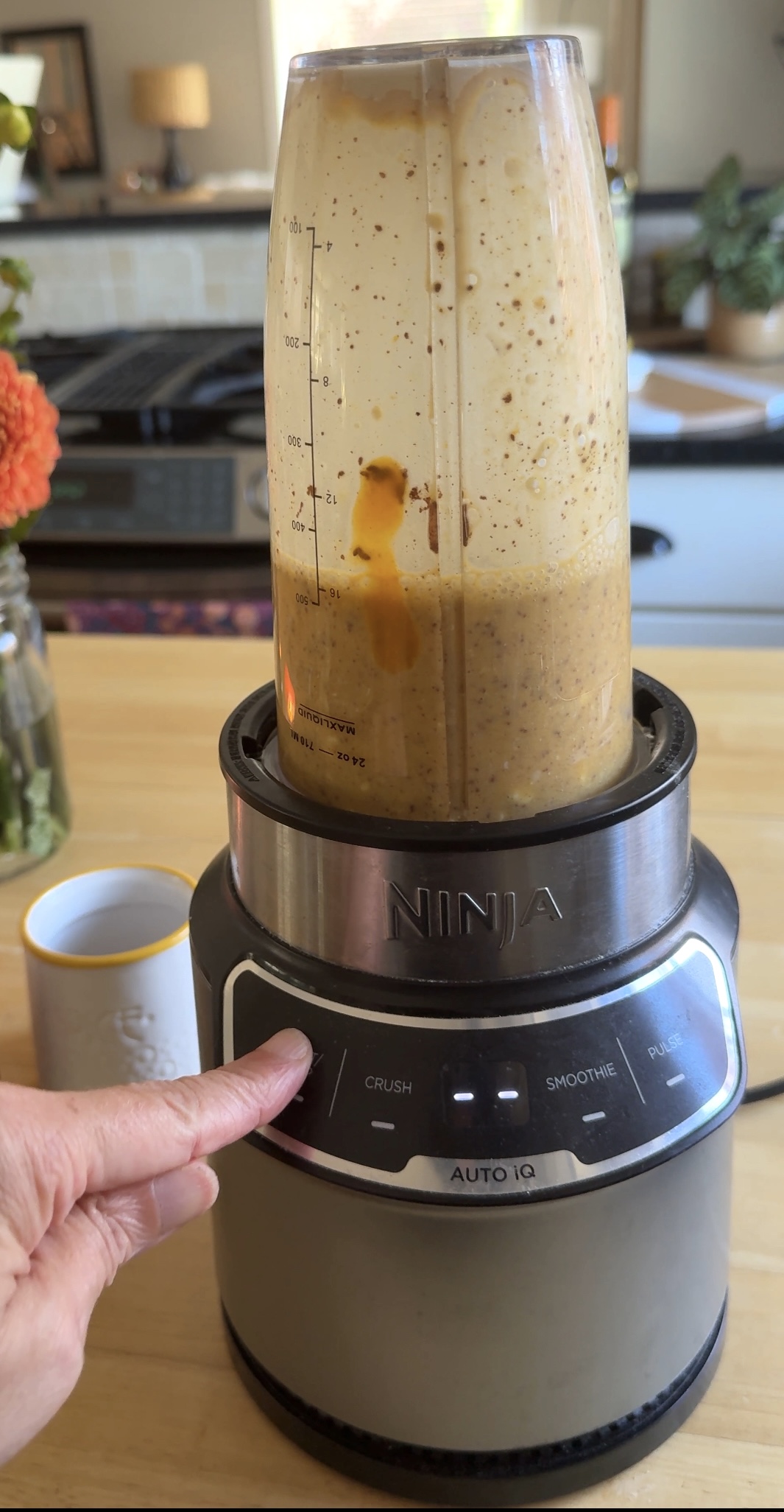 protein pumpkin smoothie with cottage cheese getting pureed in a blender