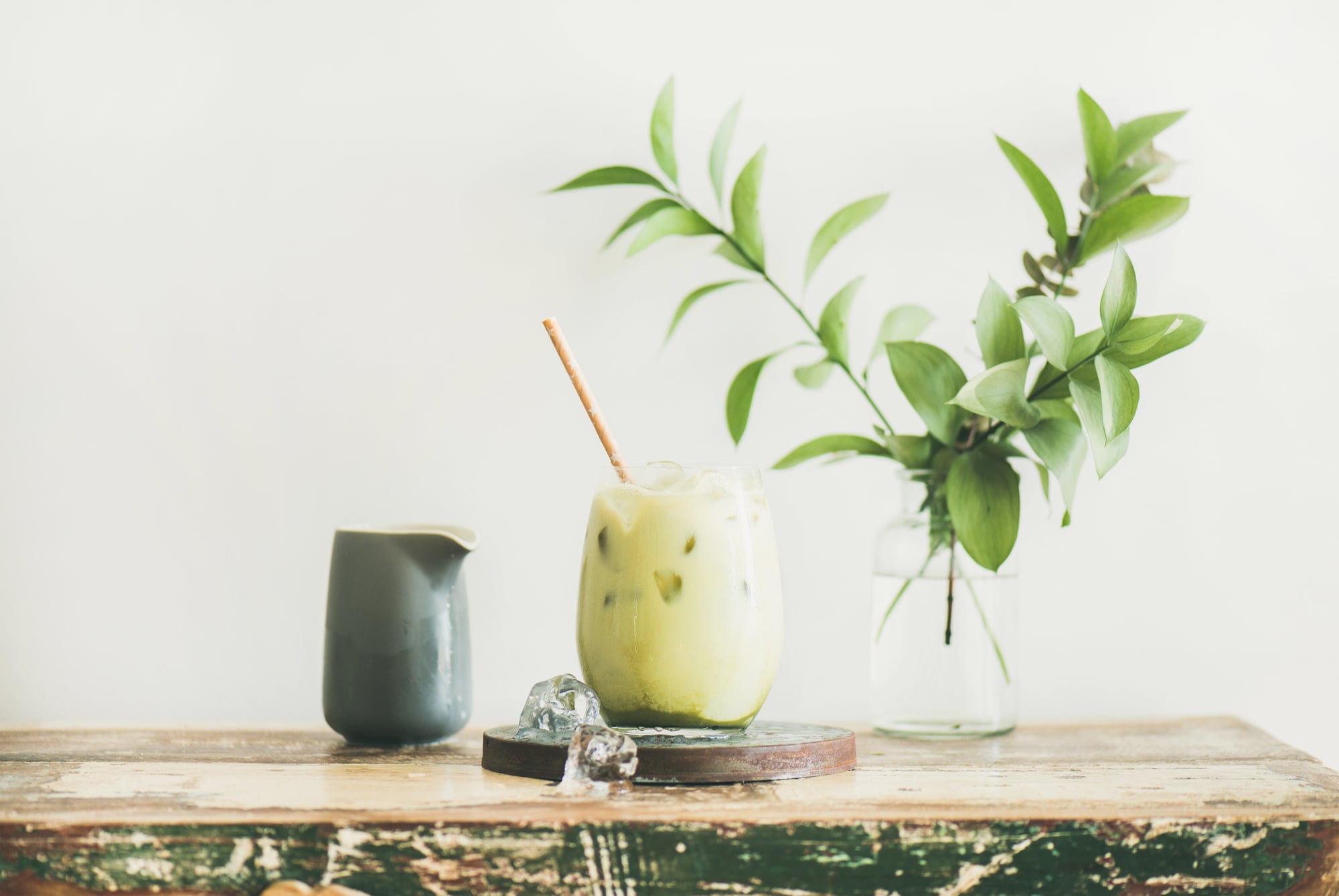 iced matcha latte on a cutting board