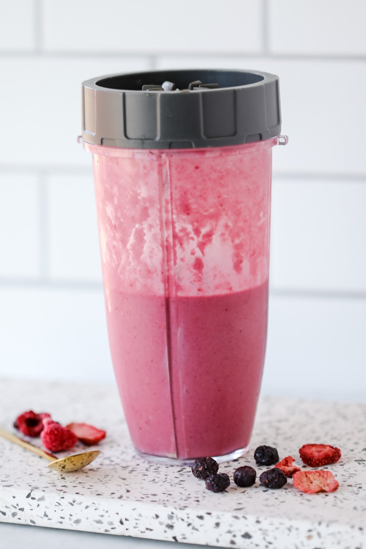 rasberry smoothie in a blender cup gettming mixed